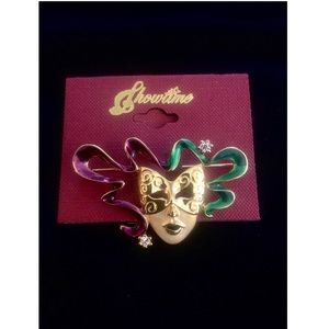Masquerade Brooch. NWT. Colors Gold, purple, green